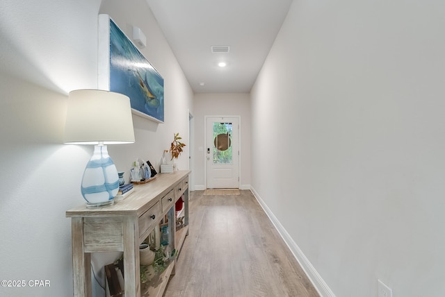 entryway with light hardwood / wood-style floors