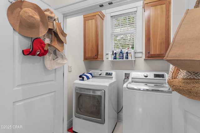 laundry area featuring cabinets and independent washer and dryer