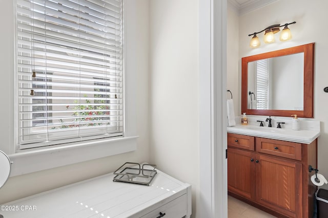 bathroom with crown molding and vanity