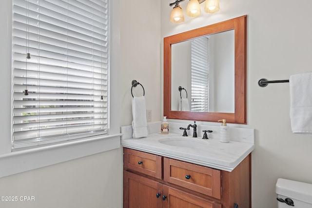 bathroom with vanity and toilet