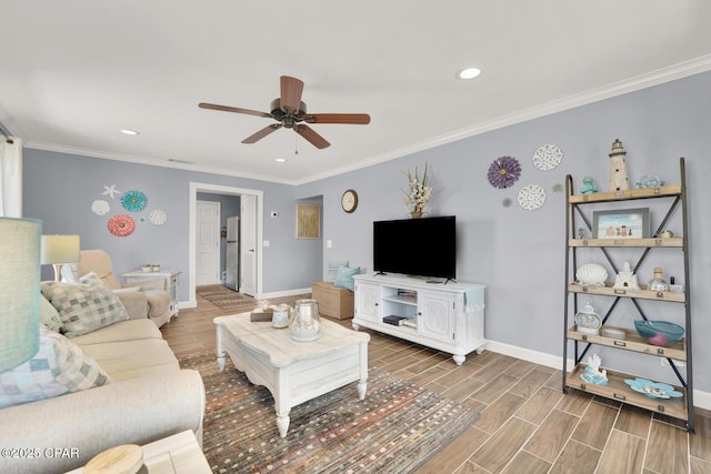 living area featuring baseboards, a ceiling fan, wood finished floors, and recessed lighting
