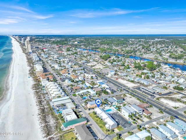 bird's eye view featuring a water view and a beach view