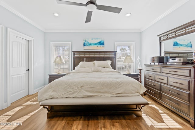 bedroom featuring ceiling fan, light wood-type flooring, and ornamental molding