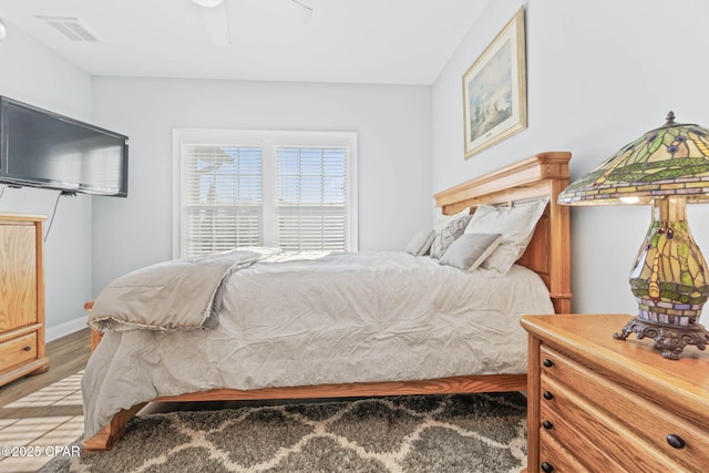 bedroom featuring ceiling fan and light wood-type flooring