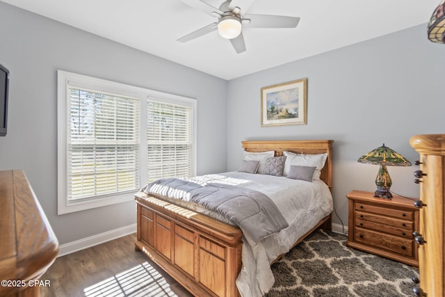 bedroom featuring ceiling fan and dark hardwood / wood-style flooring