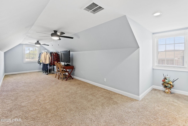 bonus room featuring light carpet, ceiling fan, and lofted ceiling