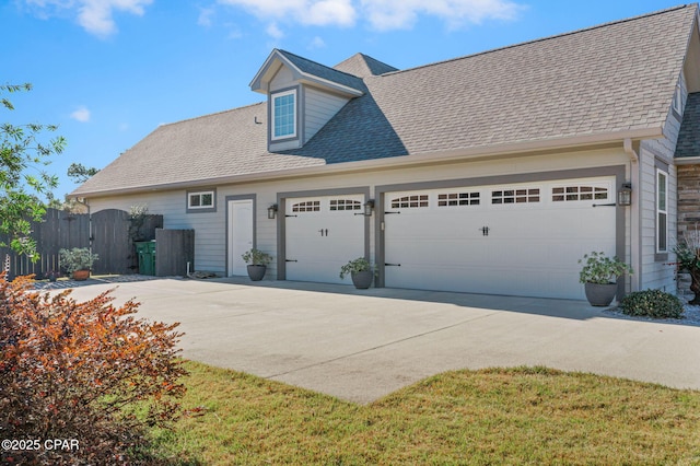 view of front facade with a front lawn and a garage