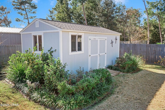 view of outdoor structure featuring a yard