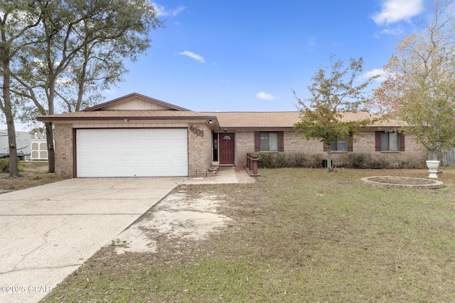 single story home featuring a garage and a front yard