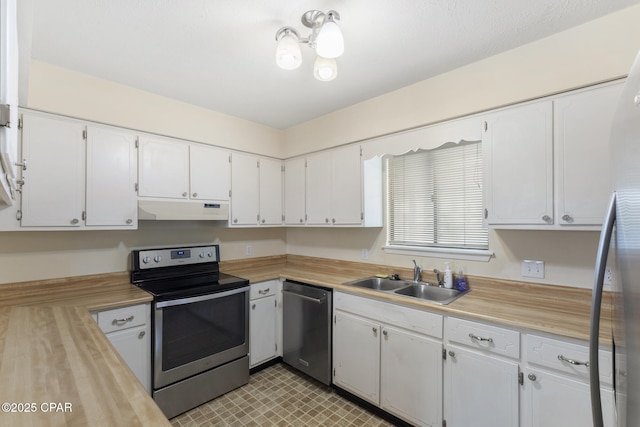 kitchen with white cabinetry, sink, and stainless steel appliances