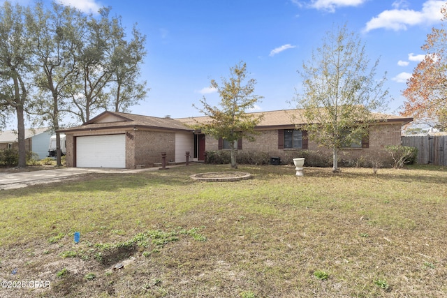 ranch-style house featuring a garage and a front yard