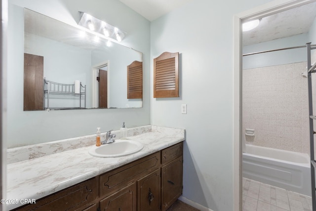 bathroom with tiled shower / bath combo and vanity