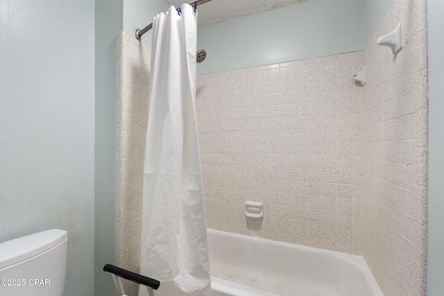 bathroom featuring toilet and shower / bathtub combination with curtain