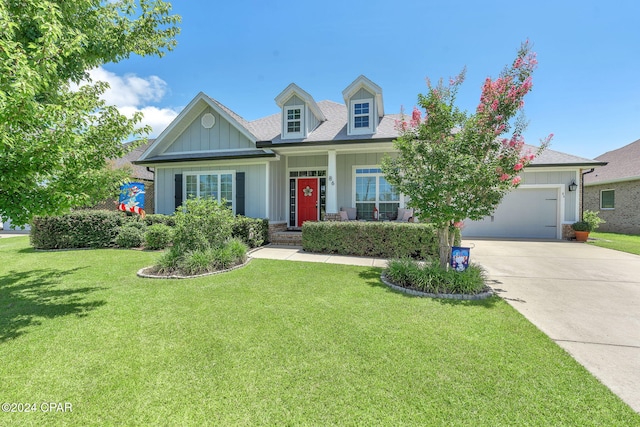 view of front of home with a front lawn and a garage