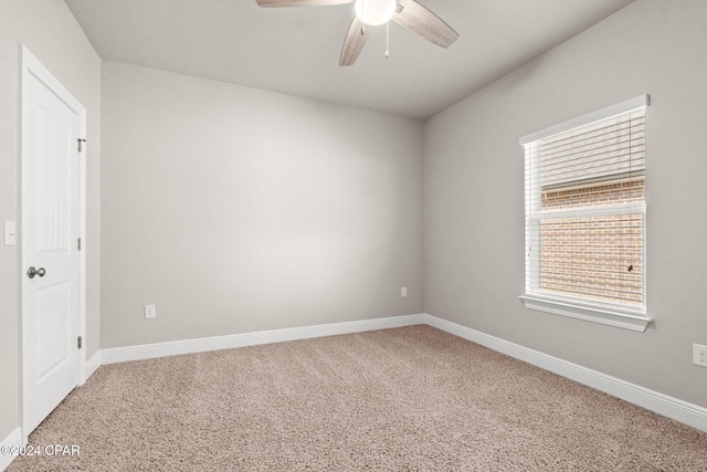 spare room featuring carpet flooring and ceiling fan