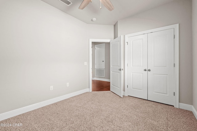 unfurnished bedroom with ceiling fan, a closet, and carpet flooring