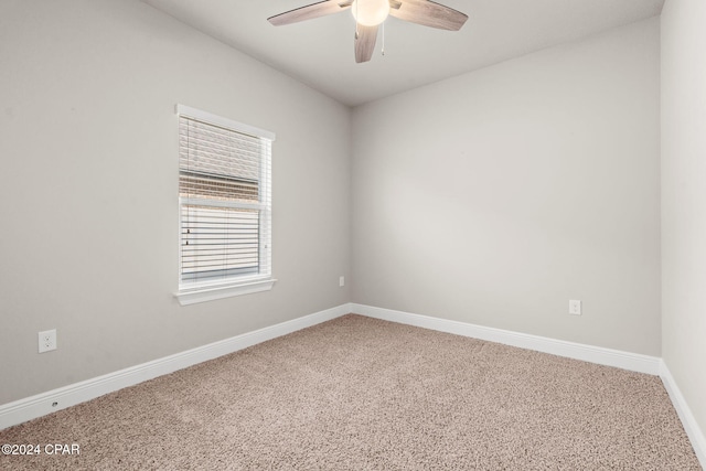 carpeted empty room with ceiling fan