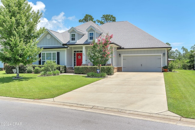 view of front of property featuring a garage and a front lawn