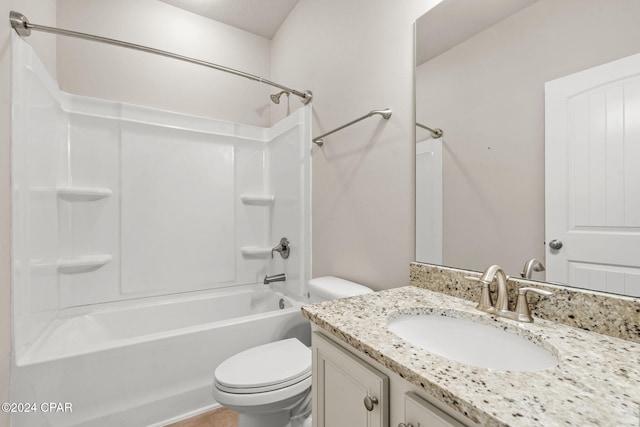 full bathroom featuring  shower combination, vanity, and toilet