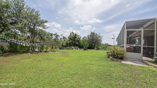 view of yard featuring a lanai