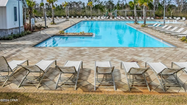 view of swimming pool featuring a patio area