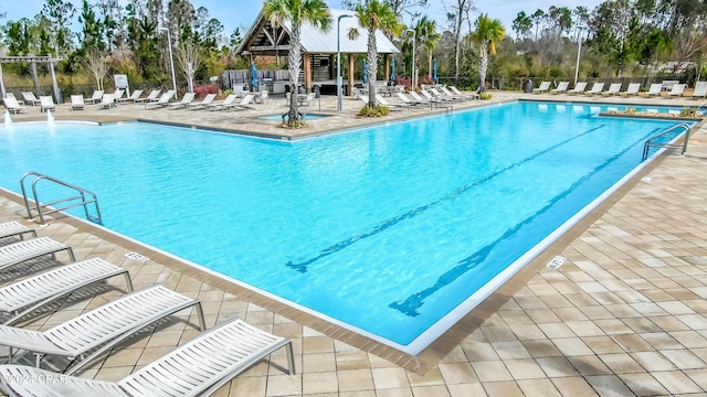 view of swimming pool featuring a gazebo and a patio area