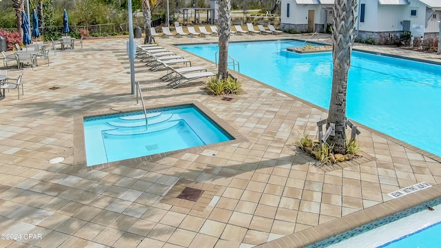 view of pool featuring a patio