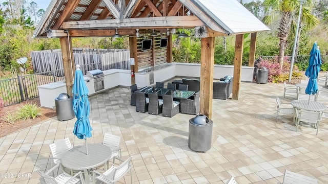 view of patio featuring an outdoor hangout area, area for grilling, and a gazebo