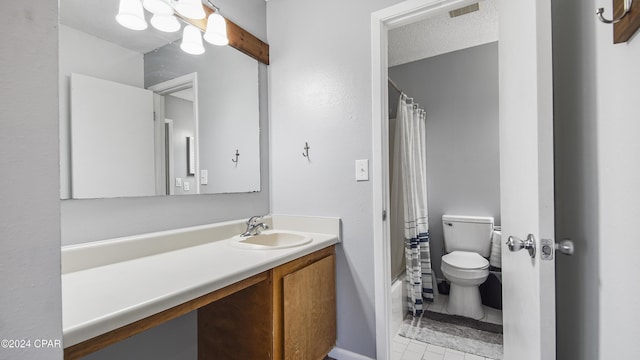 bathroom featuring visible vents, vanity, toilet, and shower / bath combo with shower curtain