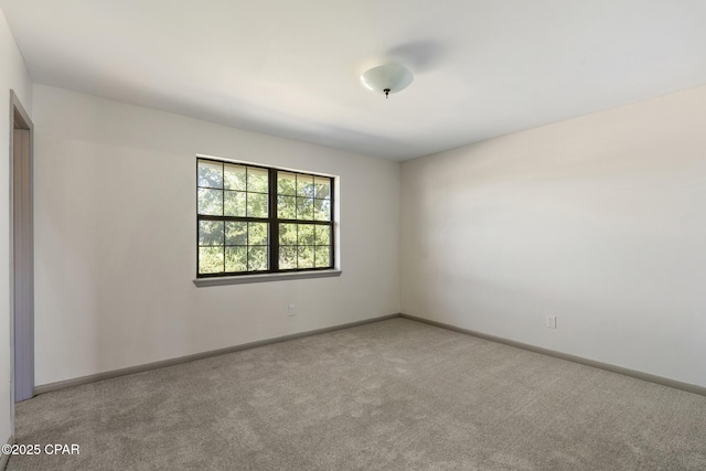 empty room featuring light colored carpet