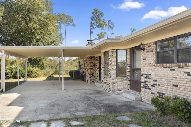 view of parking / parking lot featuring a carport