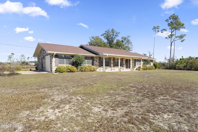 ranch-style home with a garage and a front lawn