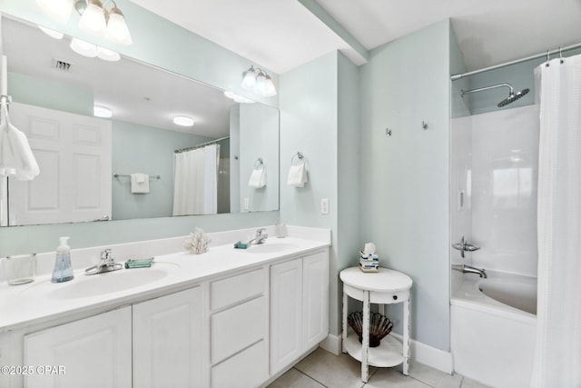 bathroom with tile patterned flooring, vanity, and shower / tub combo