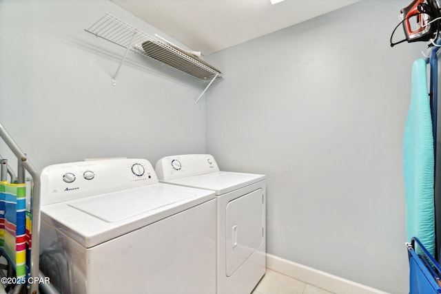 washroom with light tile patterned floors and independent washer and dryer