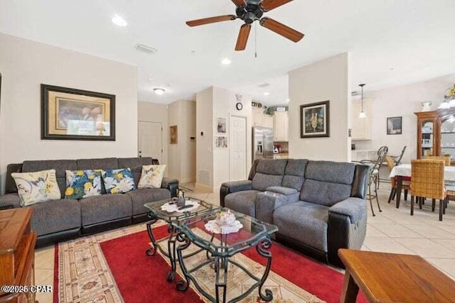 living room featuring light tile patterned flooring, recessed lighting, and a ceiling fan