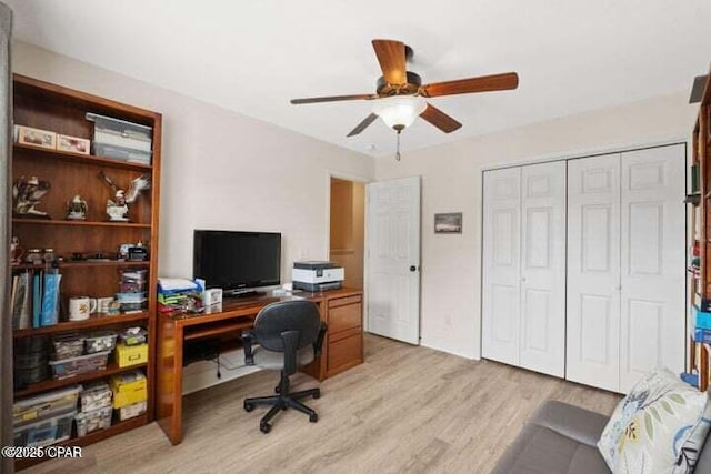 office featuring light wood-type flooring and a ceiling fan