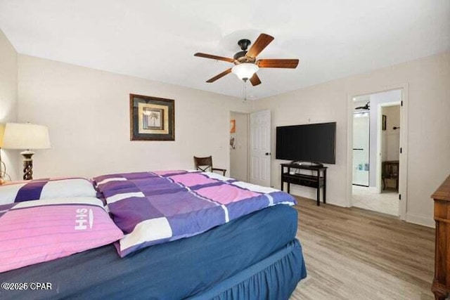 bedroom with baseboards, a ceiling fan, and wood finished floors