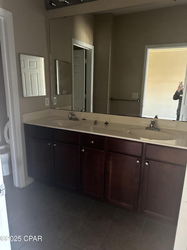 bathroom featuring tile patterned floors and vanity