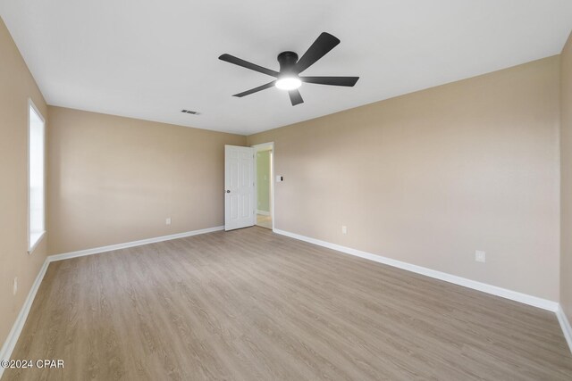 empty room featuring french doors, ceiling fan, and carpet flooring