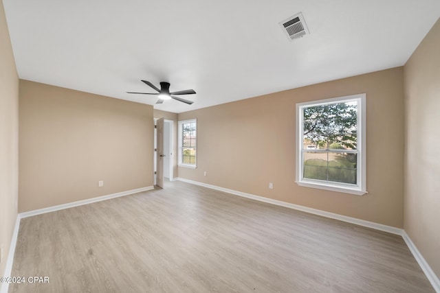 unfurnished room with ceiling fan and light hardwood / wood-style flooring