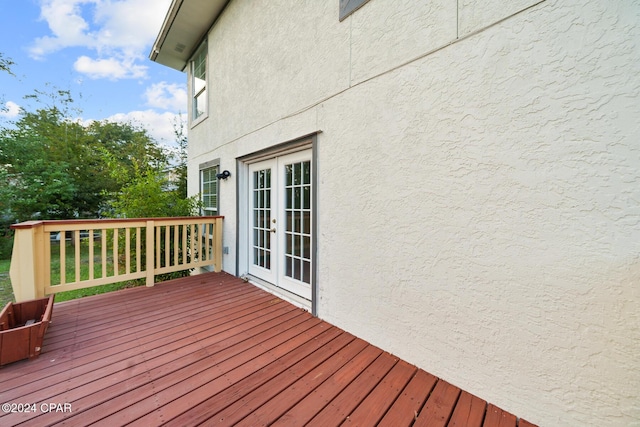 wooden deck featuring french doors