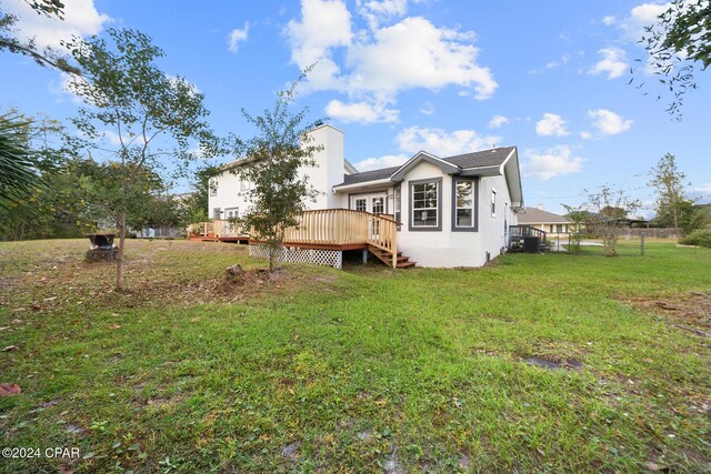 view of front of property with a garage and a front lawn