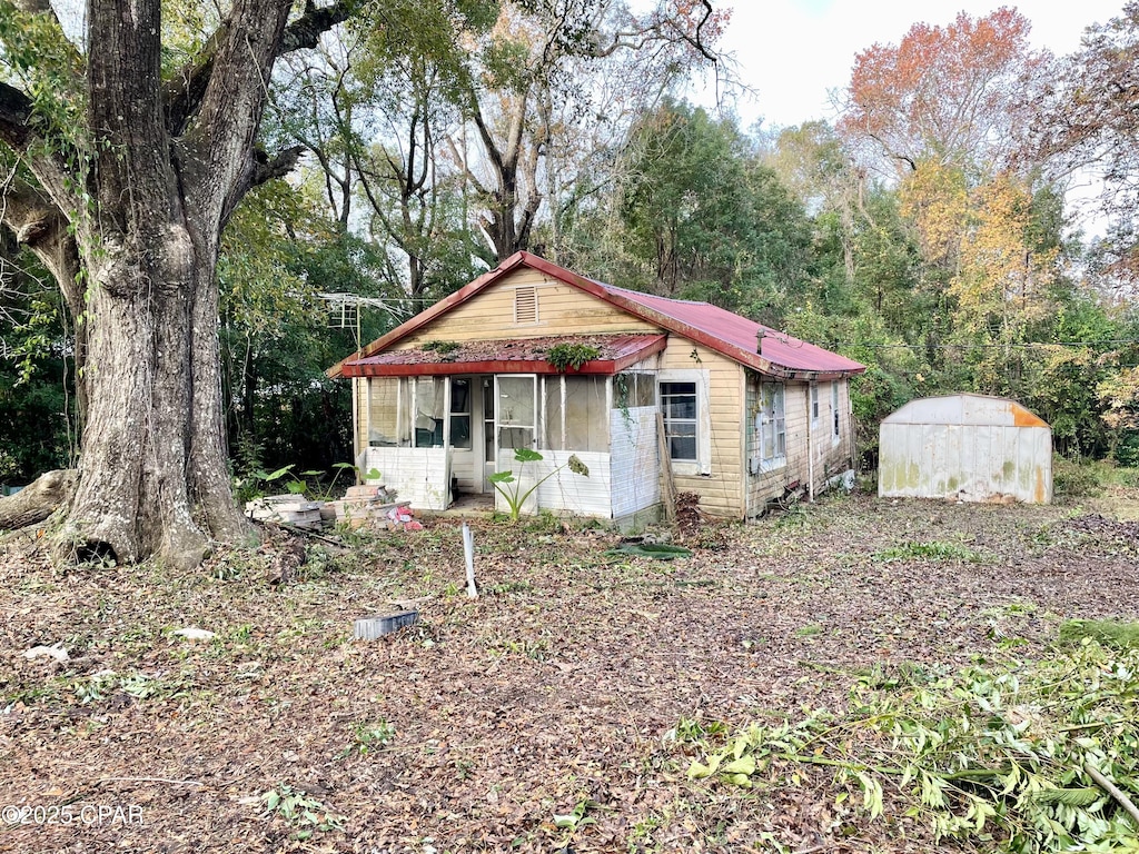 view of front of house with a shed