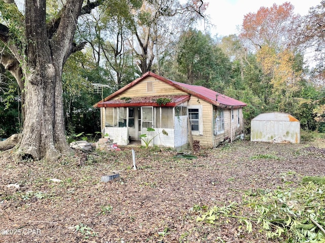 view of front of house with a shed