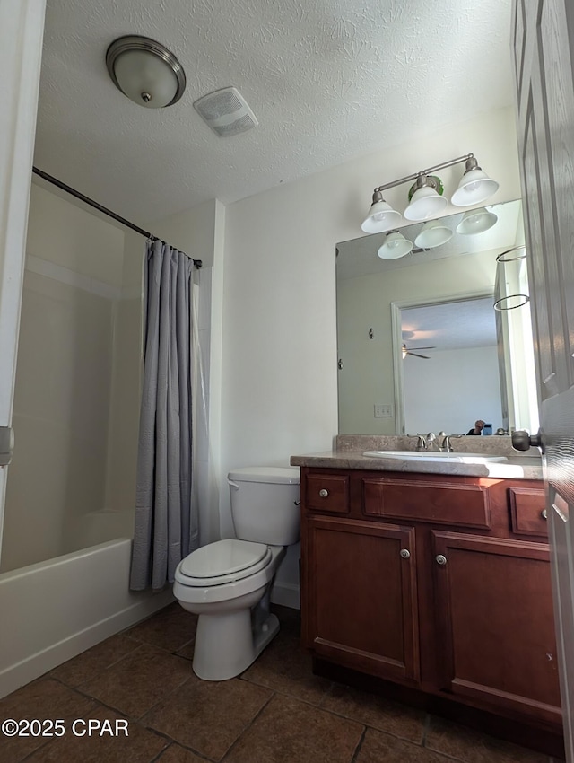 full bathroom featuring toilet, a textured ceiling, vanity, and shower / tub combo with curtain