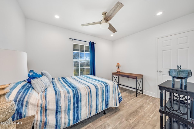 bedroom featuring ceiling fan and light hardwood / wood-style flooring