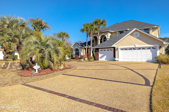 view of front of property with a garage