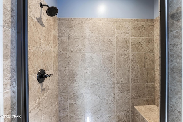 bathroom featuring tiled shower