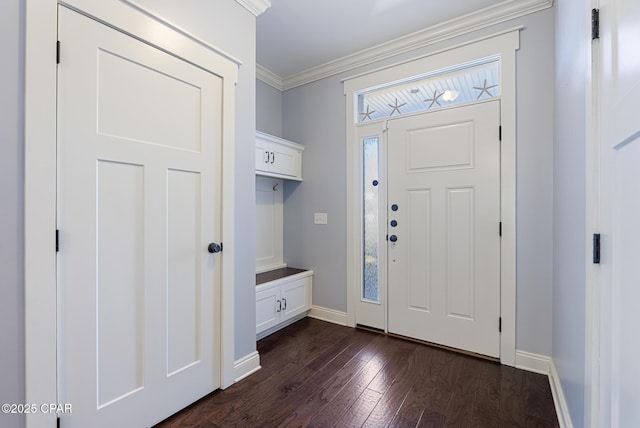 entrance foyer with crown molding and dark hardwood / wood-style floors