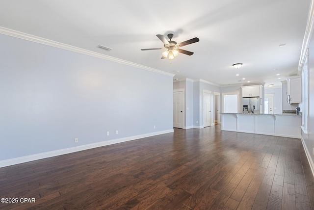 unfurnished living room featuring dark wood-type flooring, ceiling fan, and crown molding